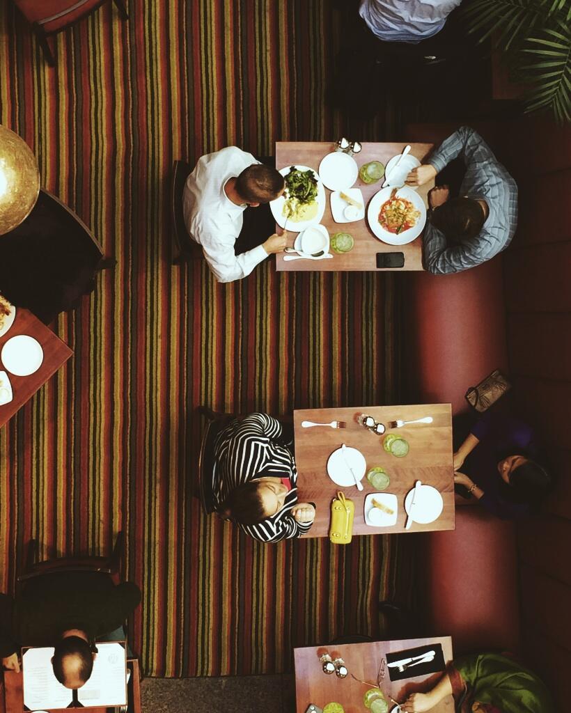 Looking down from the skyway onto people having lunch in the IDS Center.