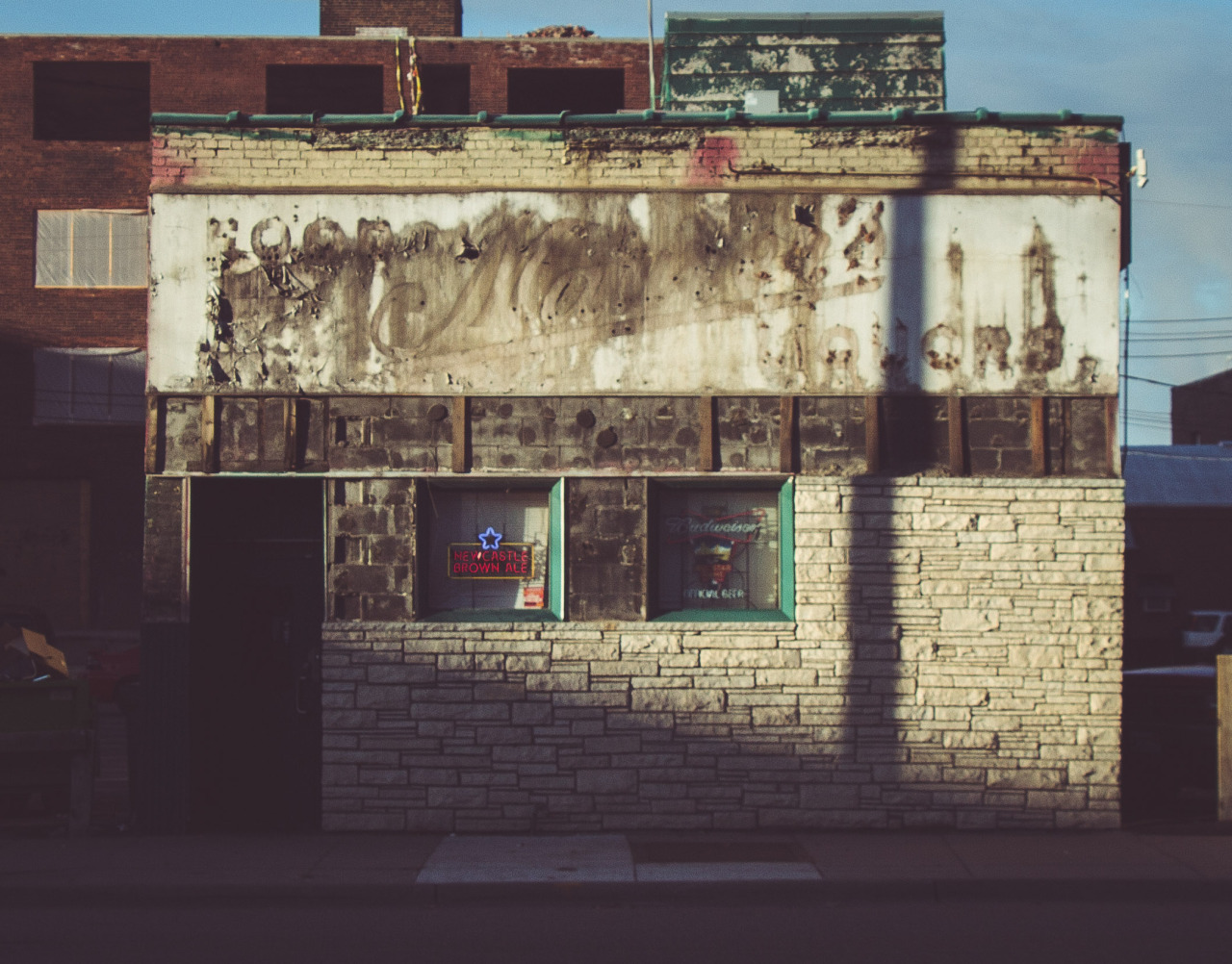 Cuzzy’s bar in the North Loop with the original signage from the bar/liquor store before it.