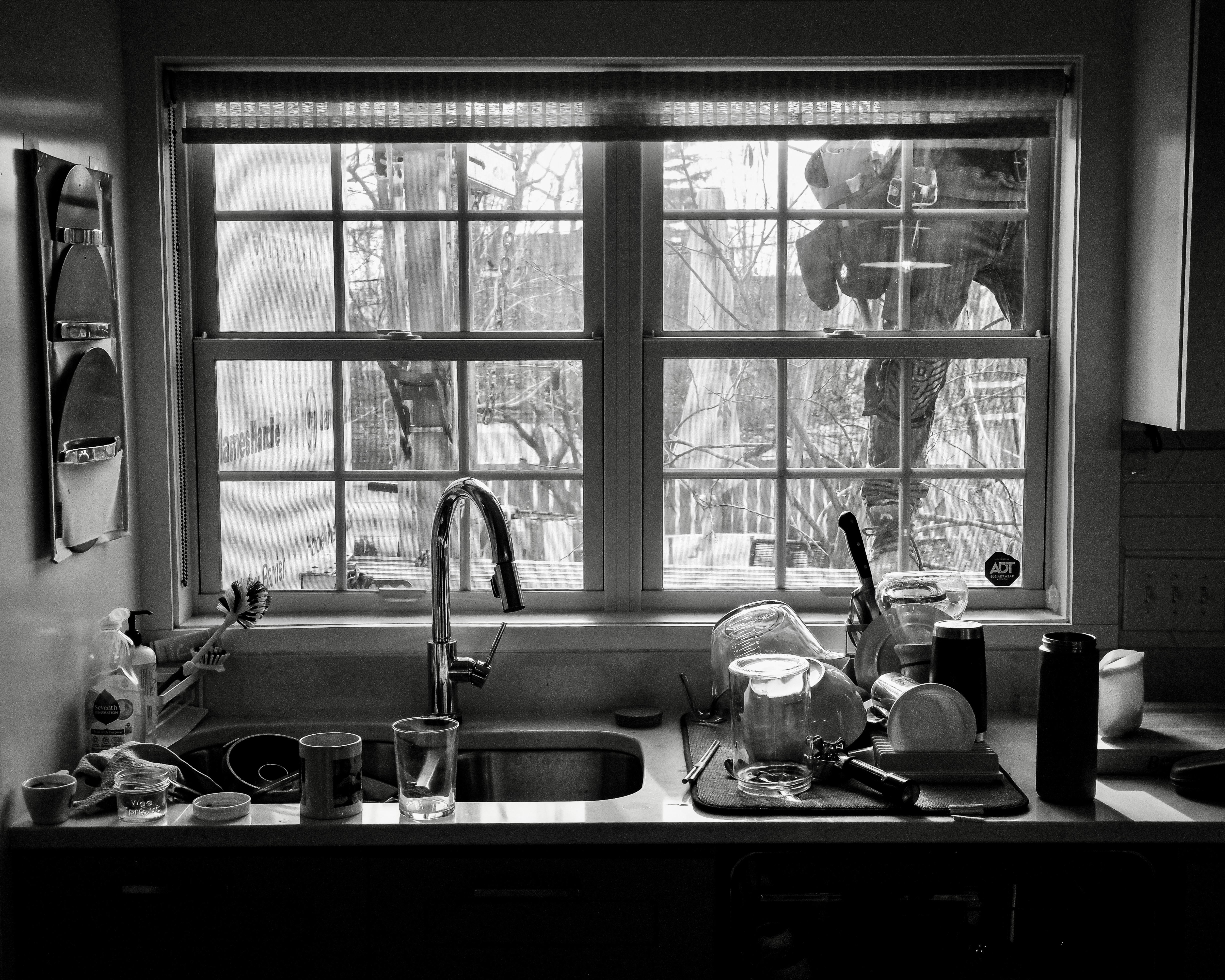 Kitchen sink with constructor worker outside