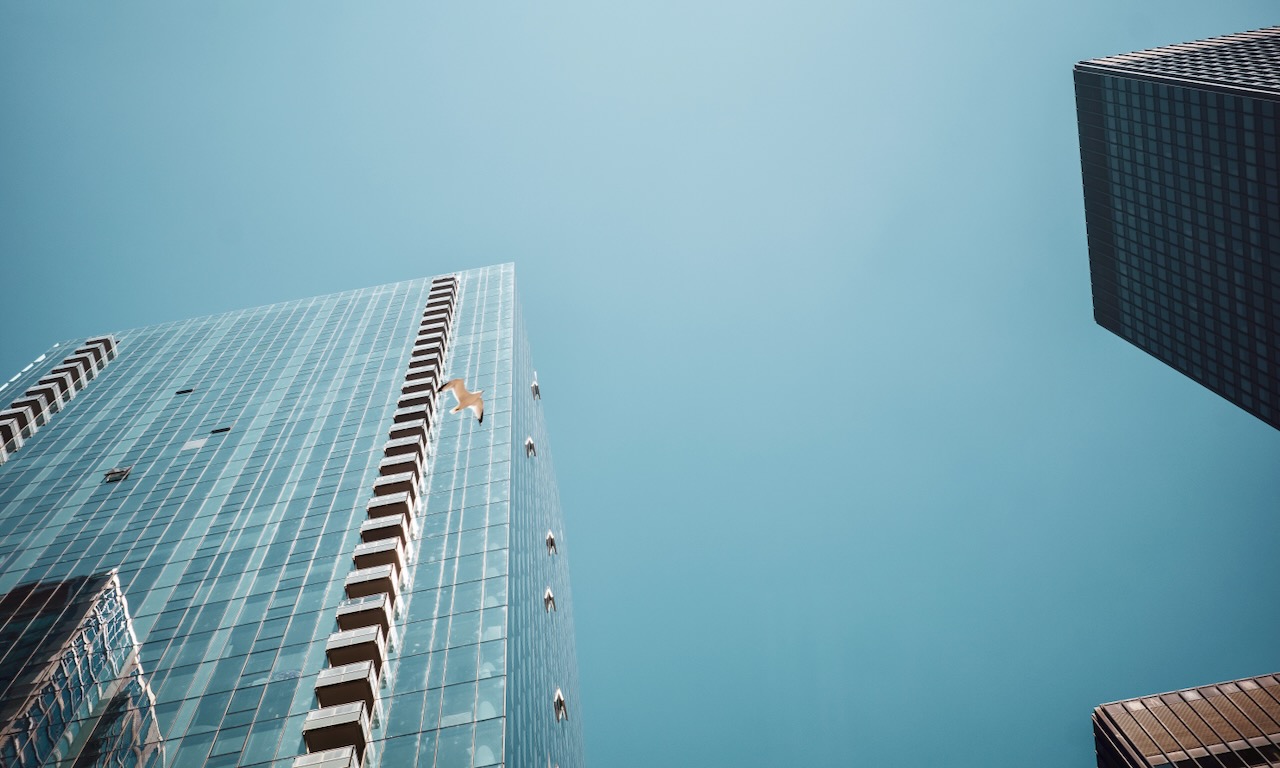 Glass tower against a clear blue sky - Chicago Loop
