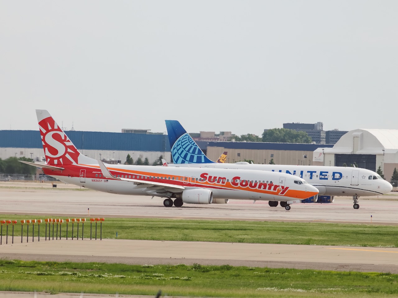 Sun Country throw back retro 737 waiting to enter the runway at MSP