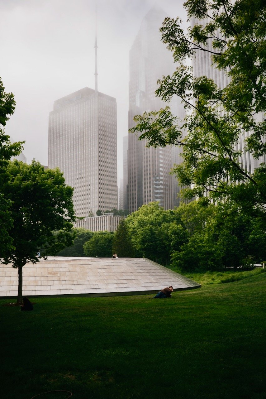Guy laying in the lawn of Maggie Daley Park - Chicago