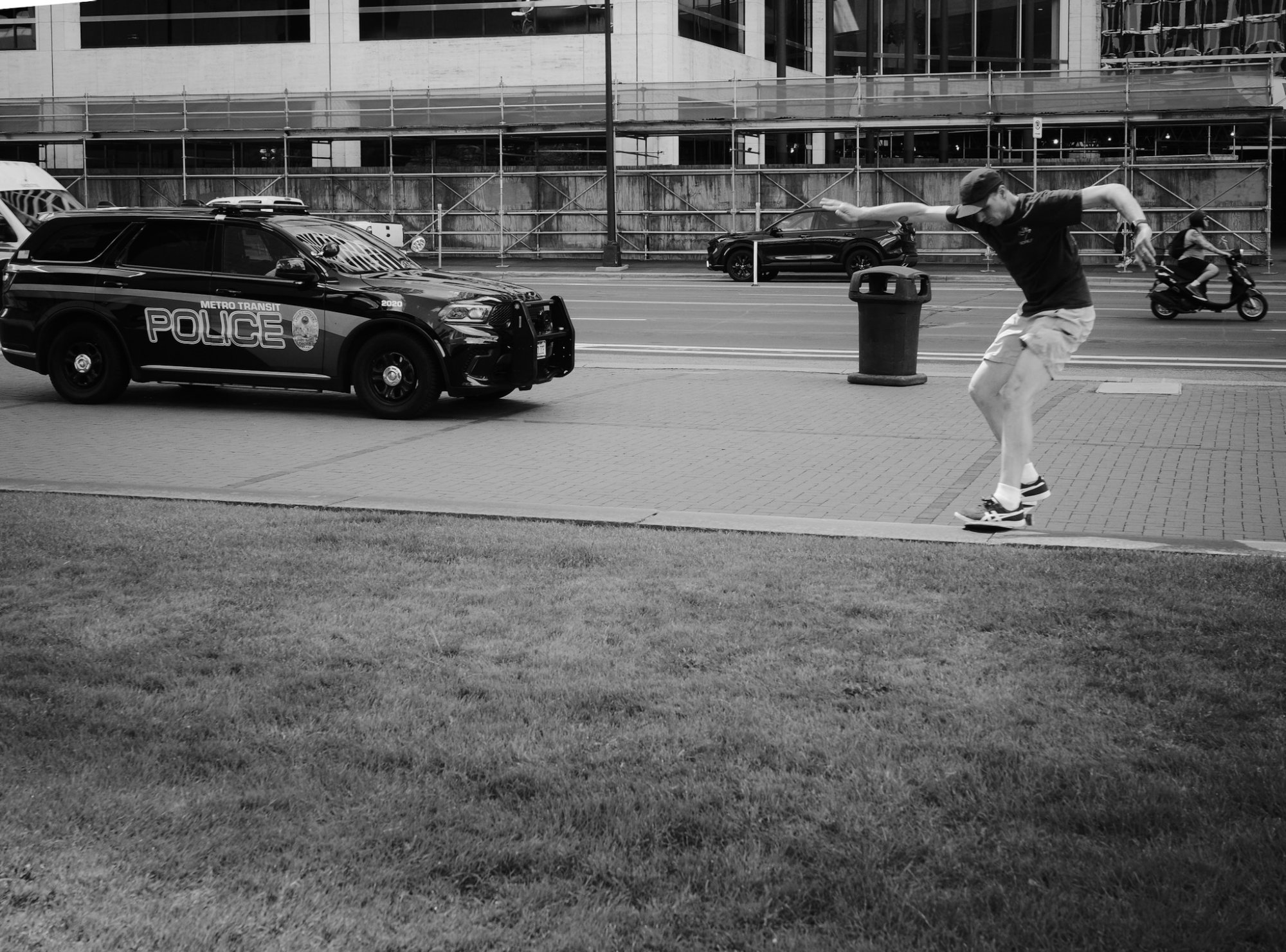 Skateboarding in front of a police car