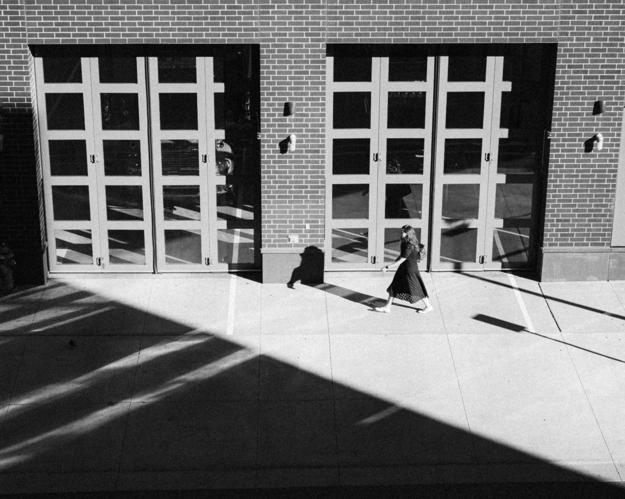 Woman walking in front of Minneapolis Fire Station 1