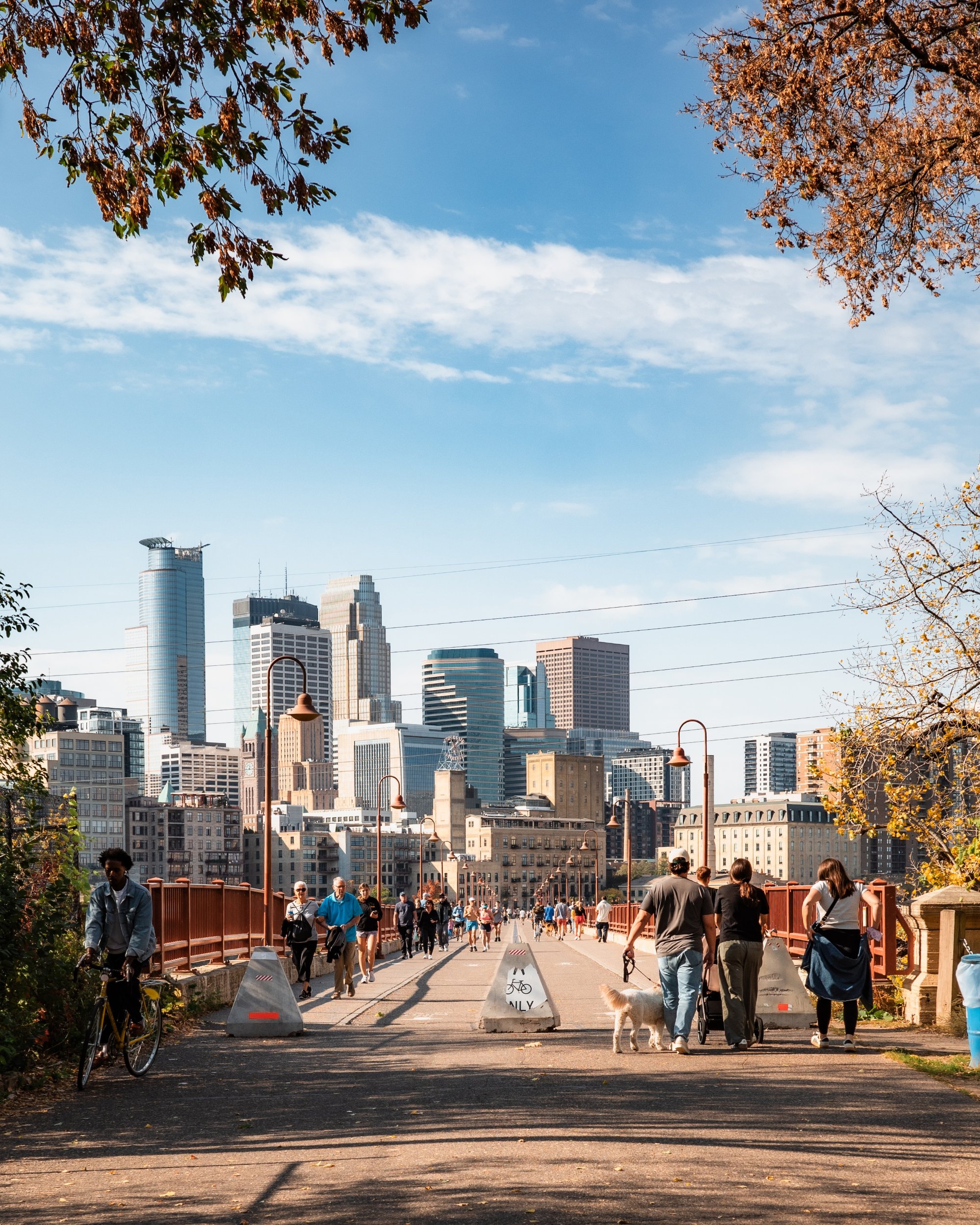 People walking across the Stone Arch Bridge Minneapolis